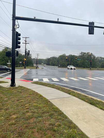 The image shows the intersection of Adelphia Road and Halls Mill Road.  