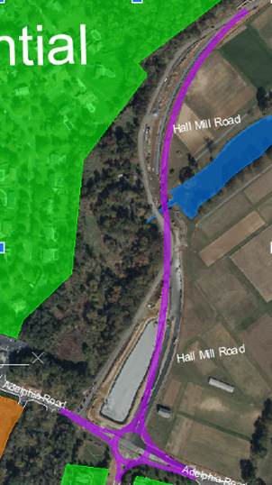Demonstrated in the image is the new roundabout intersection and alignment for Halls Mill Road and Adelphia Road, shown shaded in purple.  As well as the reservoir that is affected by the dam, shown shaded in blue. 